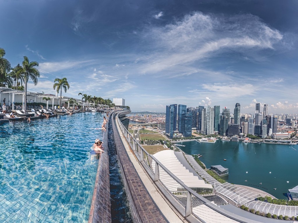 stare-out-at-singapores-skyline-while-taking-a-dip-in-the-incredible-57-story-high-infinity-pool-at-the-marina-bay-sands-hotel
