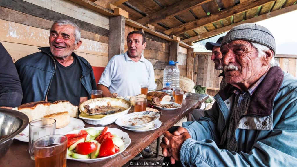 Georgian men celebrating a Supra (traditional feast) in Mestia, Svaneti, Georgia